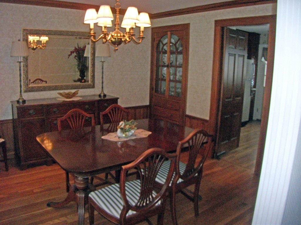 19 Churchill Road Boston, MA 02132 - Photo 6 of 17 a view of a dining room with furniture and chandelier