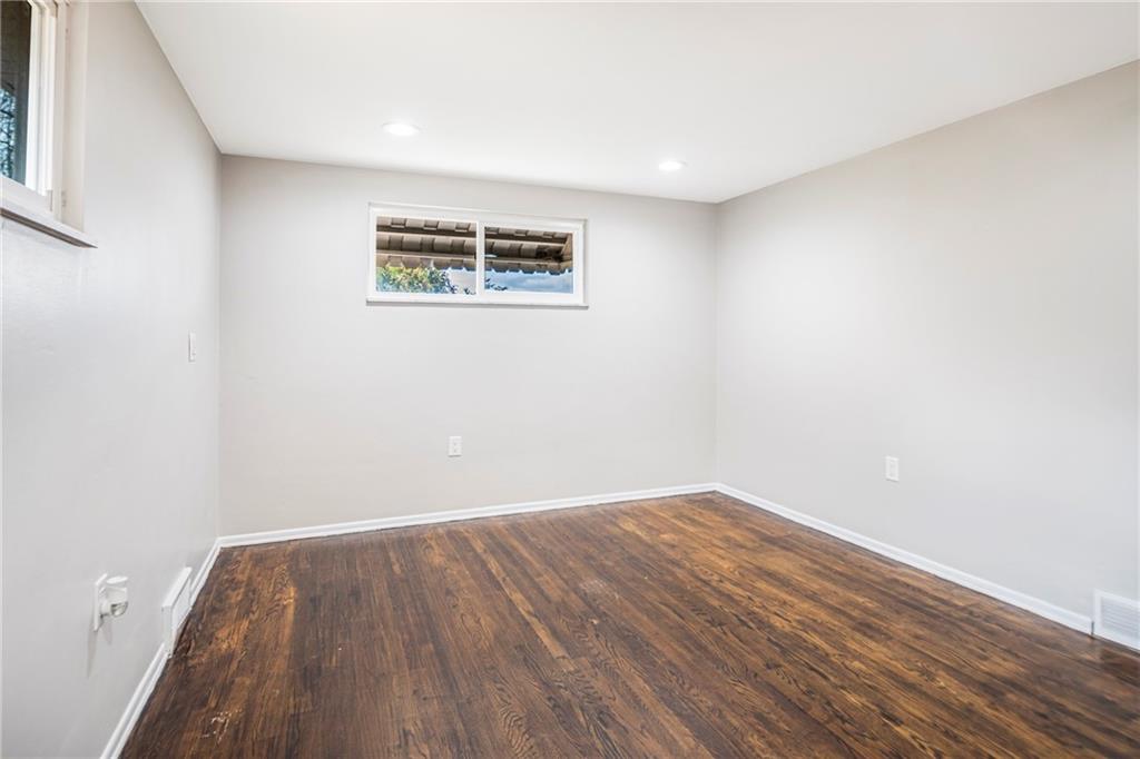 247 West Ingomar Road Pittsburgh, PA 15237 - Photo 12 of 36 an empty room with wooden floor and windows