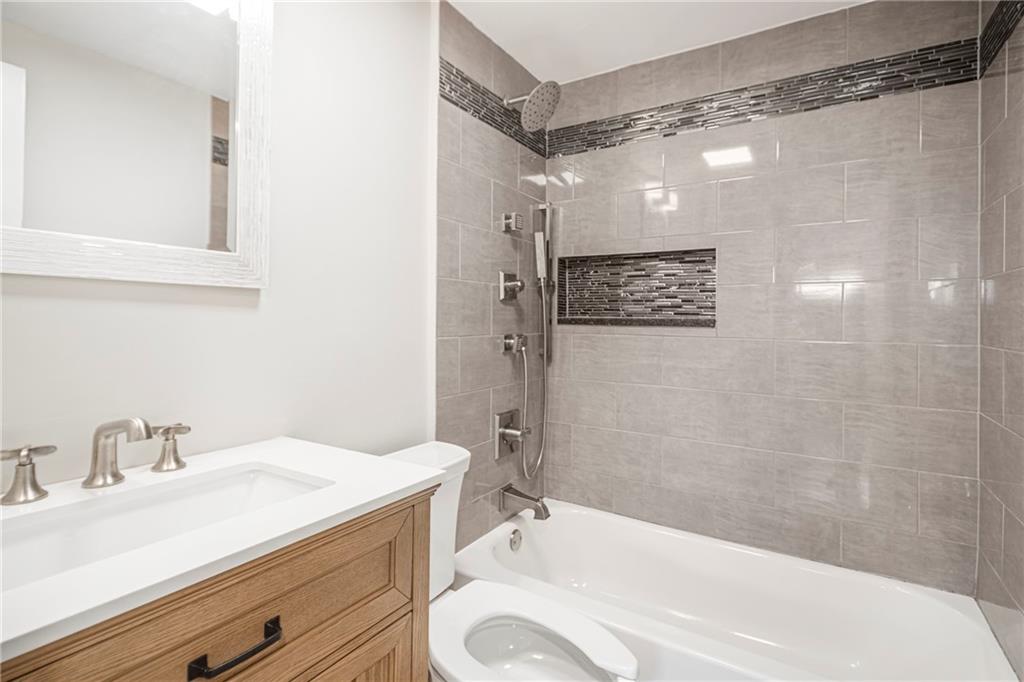 247 West Ingomar Road Pittsburgh, PA 15237 - Photo 20 of 36 a bathroom with a sink a toilet and shower
