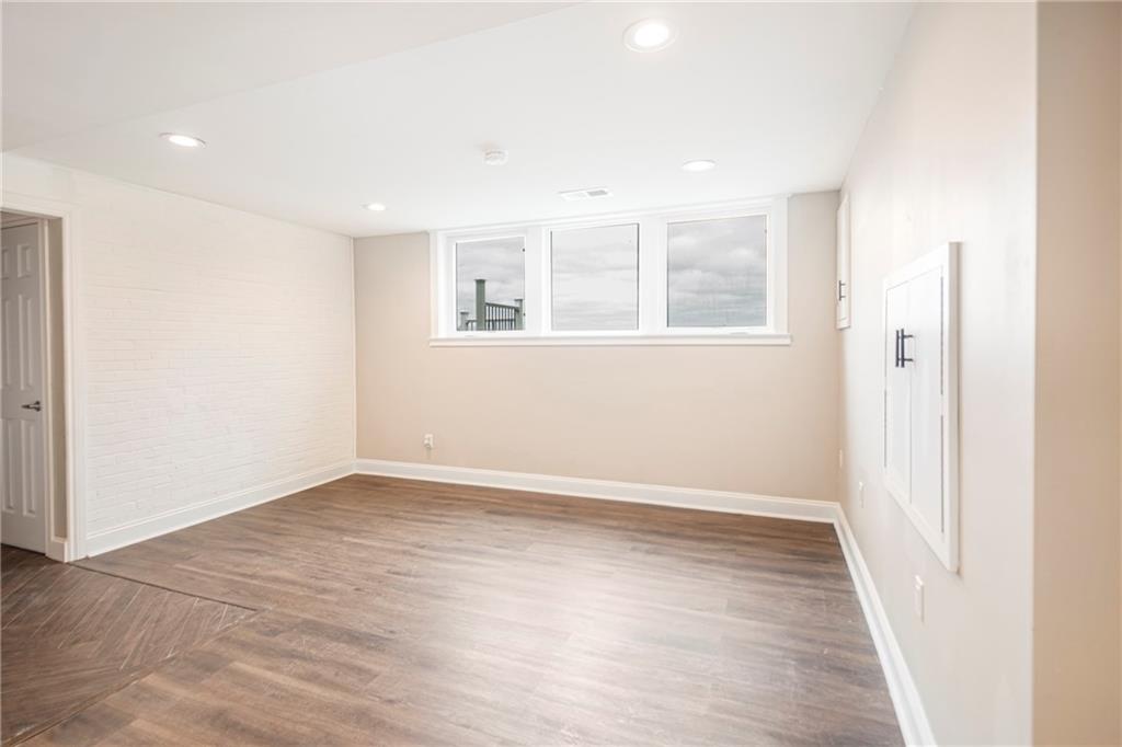 247 West Ingomar Road Pittsburgh, PA 15237 - Photo 23 of 36 an empty room with wooden floor and windows