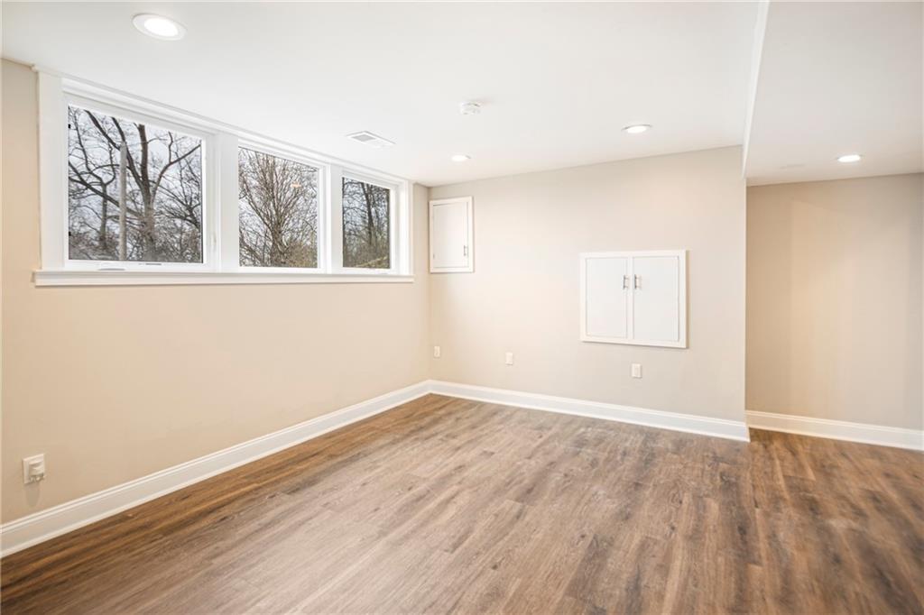 247 West Ingomar Road Pittsburgh, PA 15237 - Photo 26 of 36 an empty room with wooden floor and windows