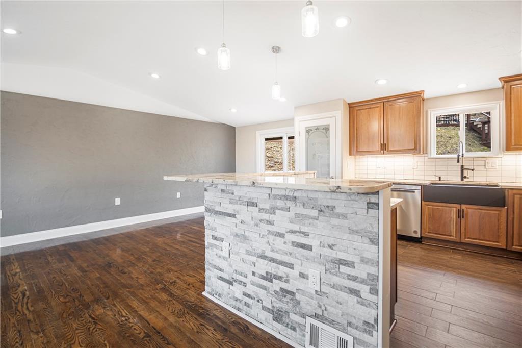247 West Ingomar Road Pittsburgh, PA 15237 - Photo 3 of 36 a kitchen with granite countertop a sink and a stove top oven