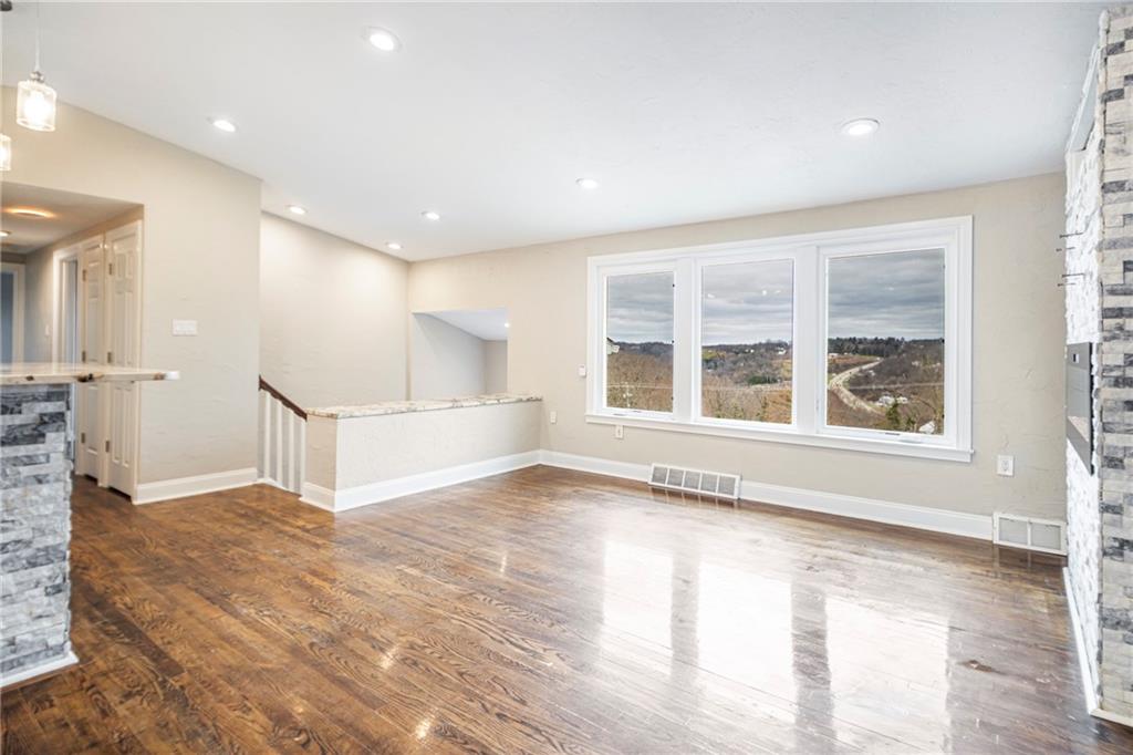 247 West Ingomar Road Pittsburgh, PA 15237 - Photo 6 of 36 a view of an empty room with a window and wooden floor