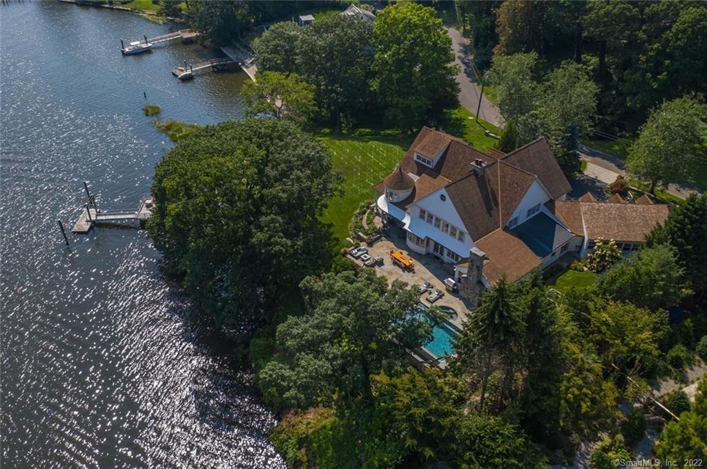 an aerial view of a house with outdoor space and street view