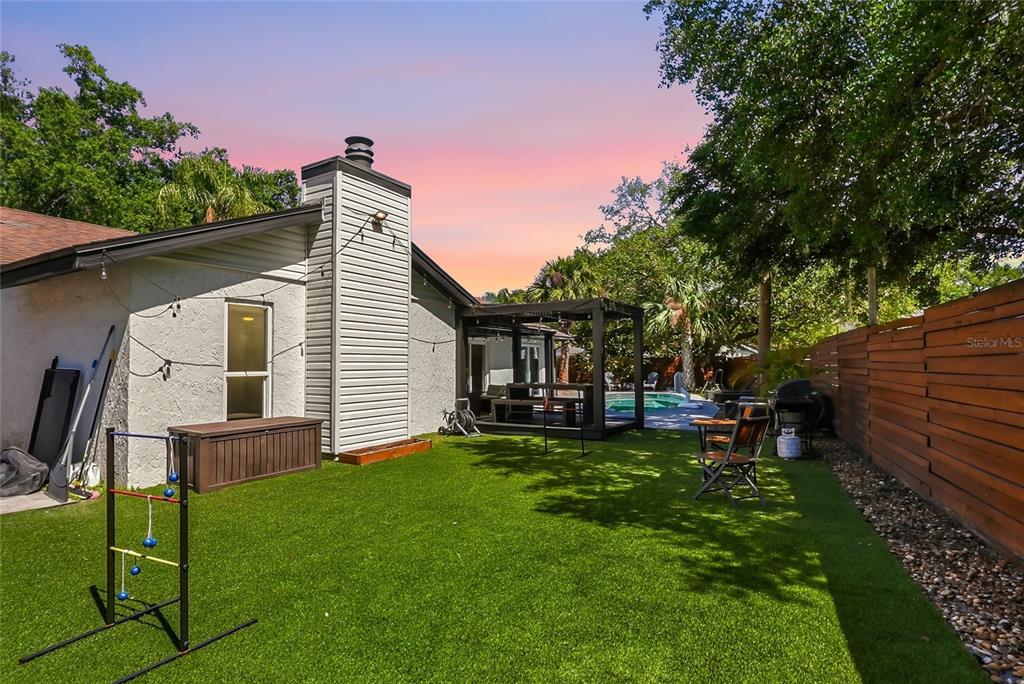 4606 Buckeye Road Tampa, FL 33624 - Photo 7 of 39 a backyard of a house with table and chairs