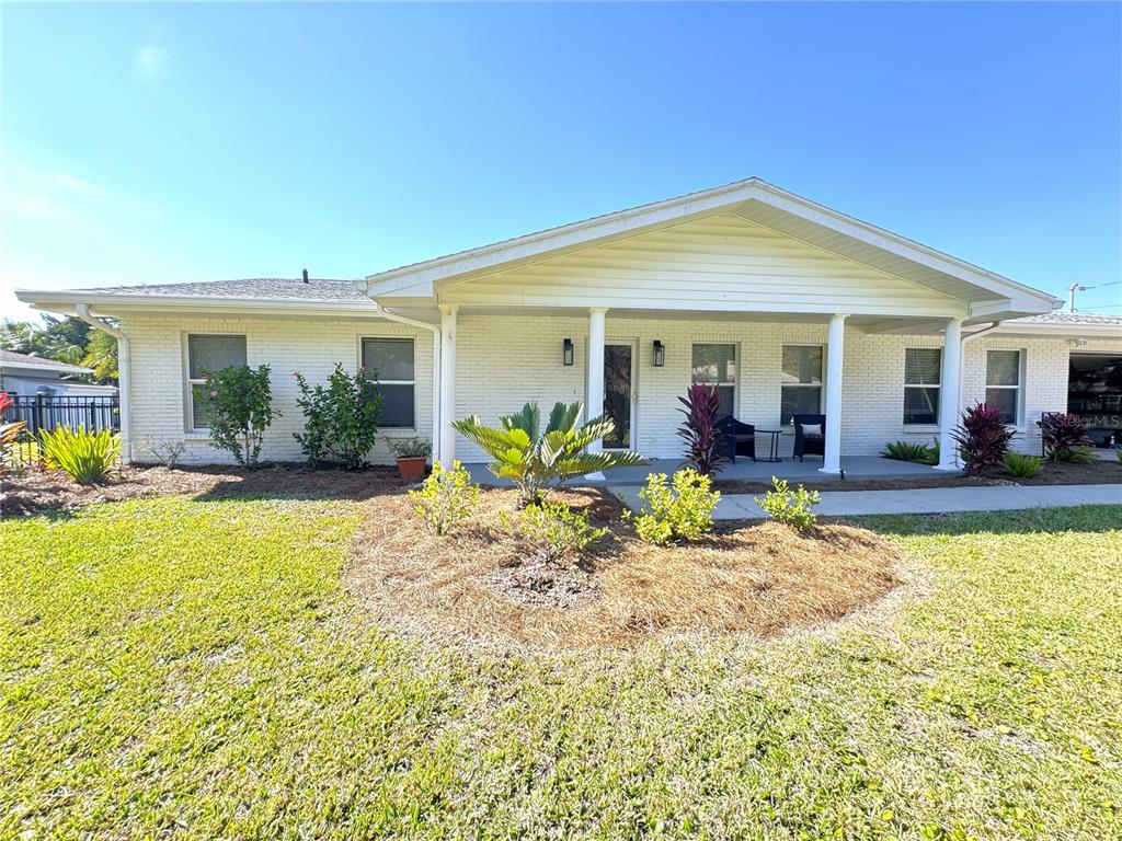 1004 Southeast 5th Avenue Crystal River, FL 34429 - Photo 2 of 43 a view of a house with swimming pool and a porch