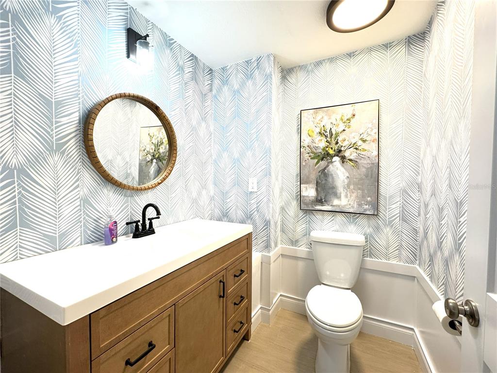 1004 Southeast 5th Avenue Crystal River, FL 34429 - Photo 27 of 43 a bathroom with a toilet a sink and a mirror