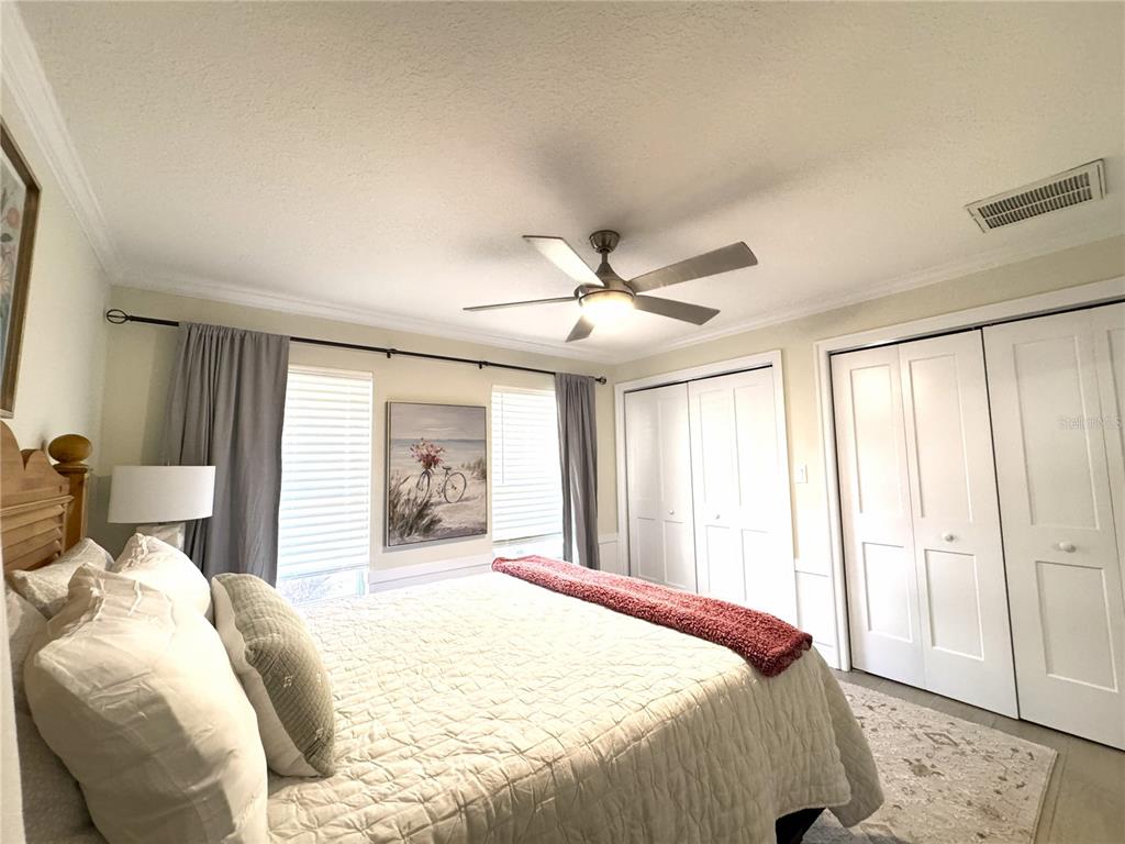 1004 Southeast 5th Avenue Crystal River, FL 34429 - Photo 30 of 43 a bedroom with a large bed and a large window