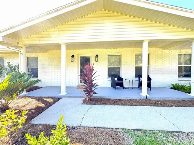 a view of living room filled with furniture