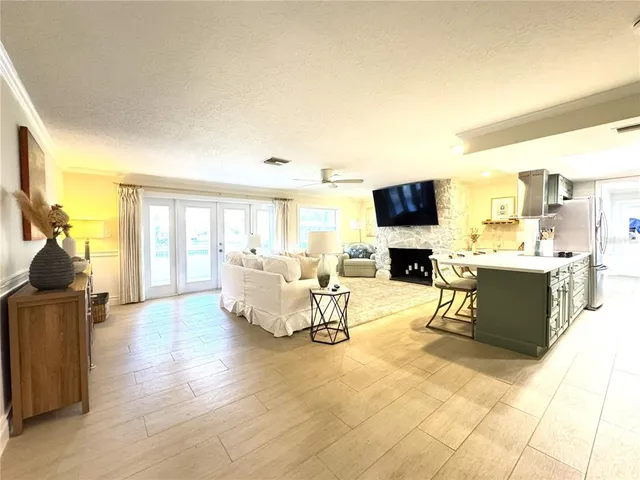 a living room with fireplace furniture and a flat screen tv