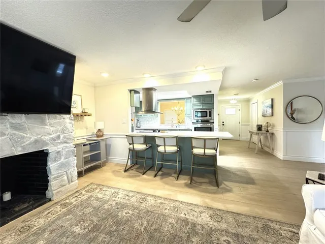 a large kitchen with a table and chairs in it