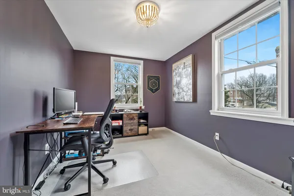 a workspace with furniture and window