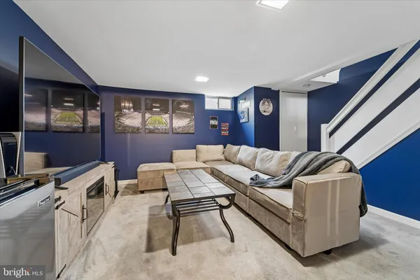 a living room with furniture and window