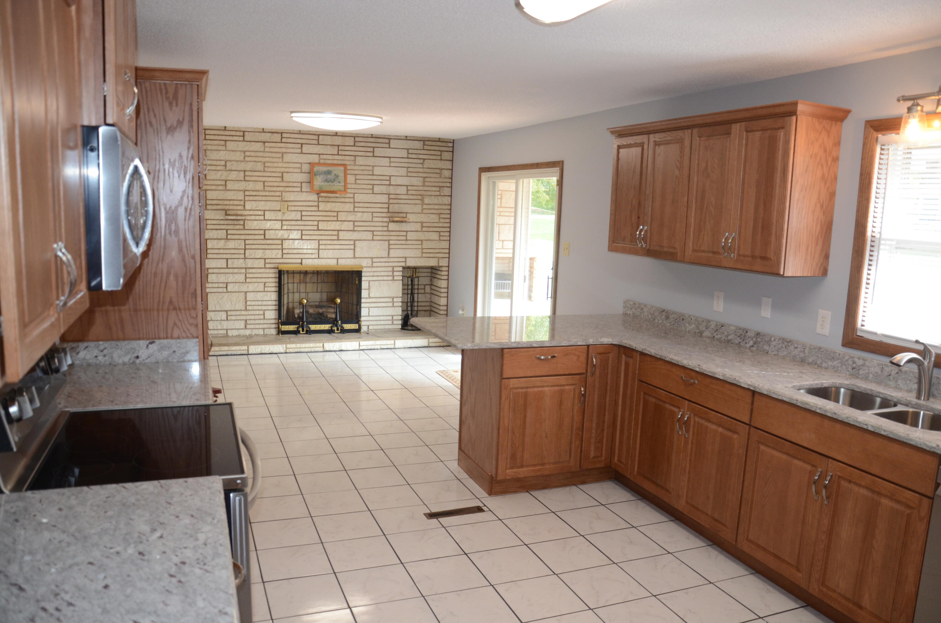 405 Sells Road Bluff City, TN 37618 - Photo 15 of 42 15 Kitchen and Fireplace