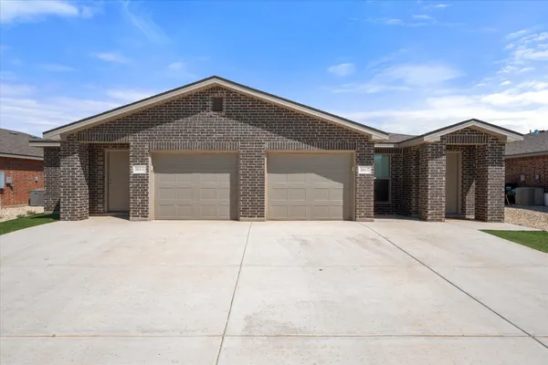 a front view of a house with a garage