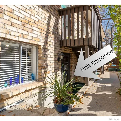 a view of a brick house with large windows