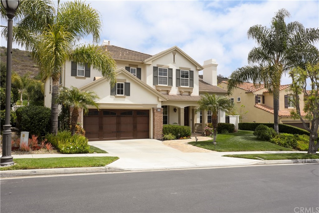 19 Calle Pacifica San Clemente, CA 92673 - Photo 1 of 10 a front view of a house with a yard and potted plants