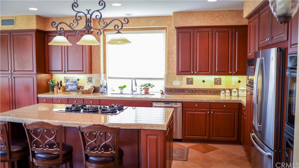 19 Calle Pacifica San Clemente, CA 92673 - Photo 3 of 10 a kitchen with a sink and a refrigerator