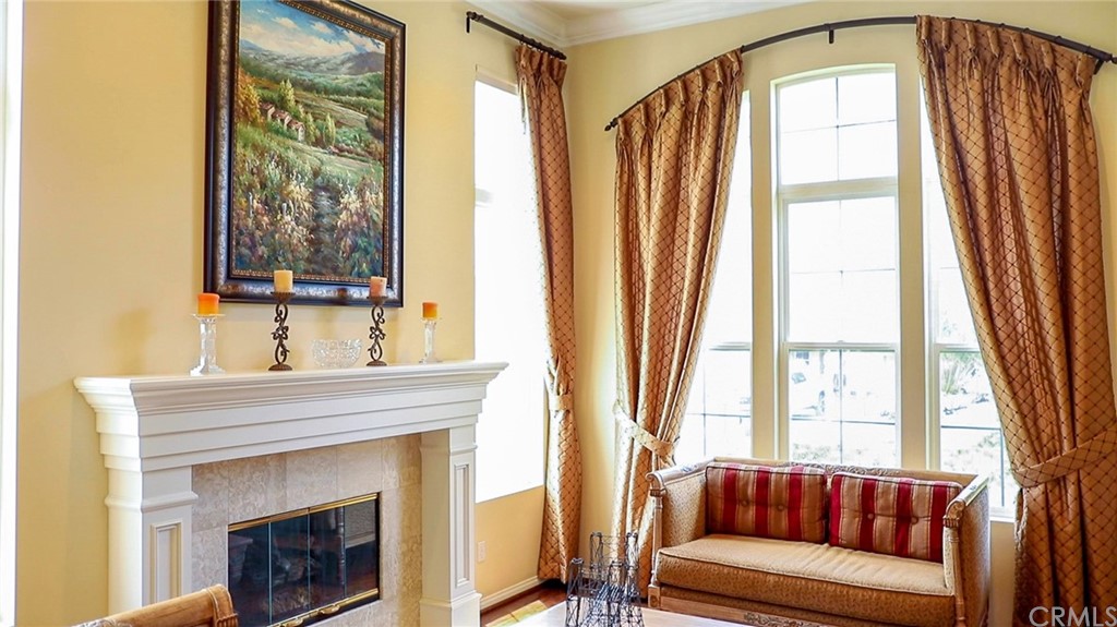 19 Calle Pacifica San Clemente, CA 92673 - Photo 7 of 10 a living room with a large window and a fireplace