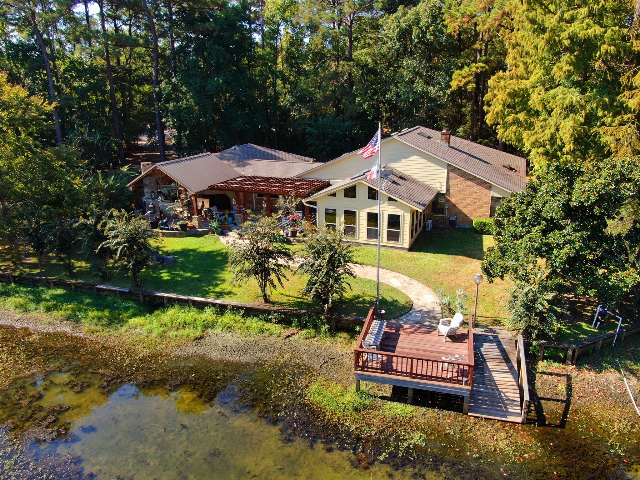 89 Heatley Street Trinity, TX 75862 - Photo 1 of 49 a front view of a house with garden