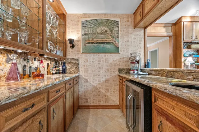 a kitchen with stainless steel appliances granite countertop a stove and a sink