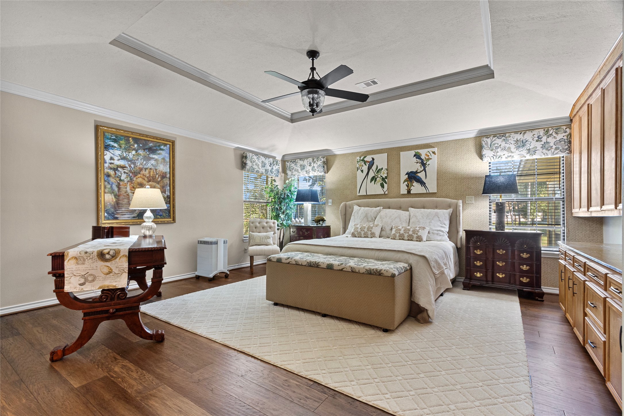 89 Heatley Street Trinity, TX 75862 - Photo 26 of 49 a spacious bedroom with a bed a window and a chandelier