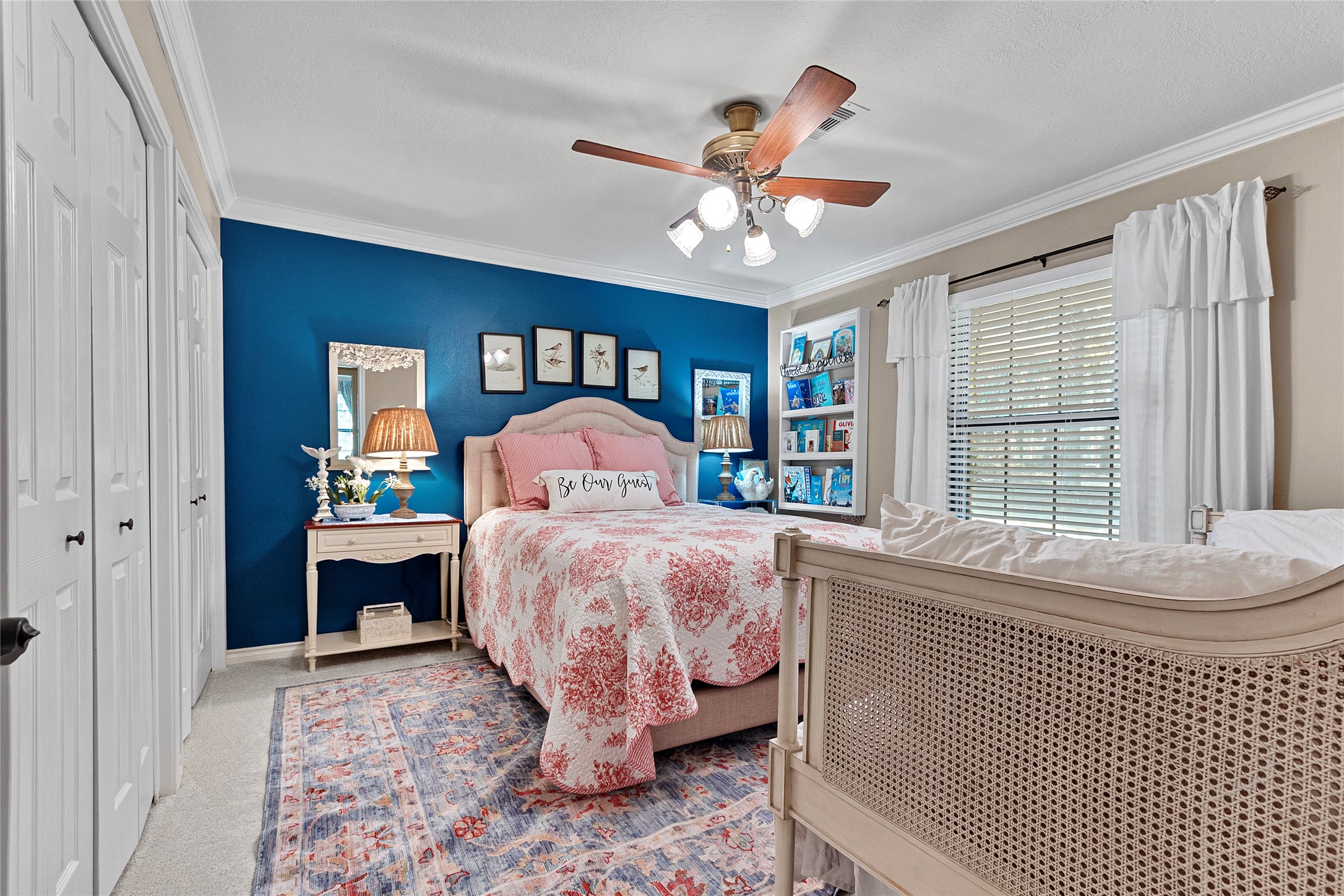 89 Heatley Street Trinity, TX 75862 - Photo 30 of 49 a bedroom with a large bed and a chandelier