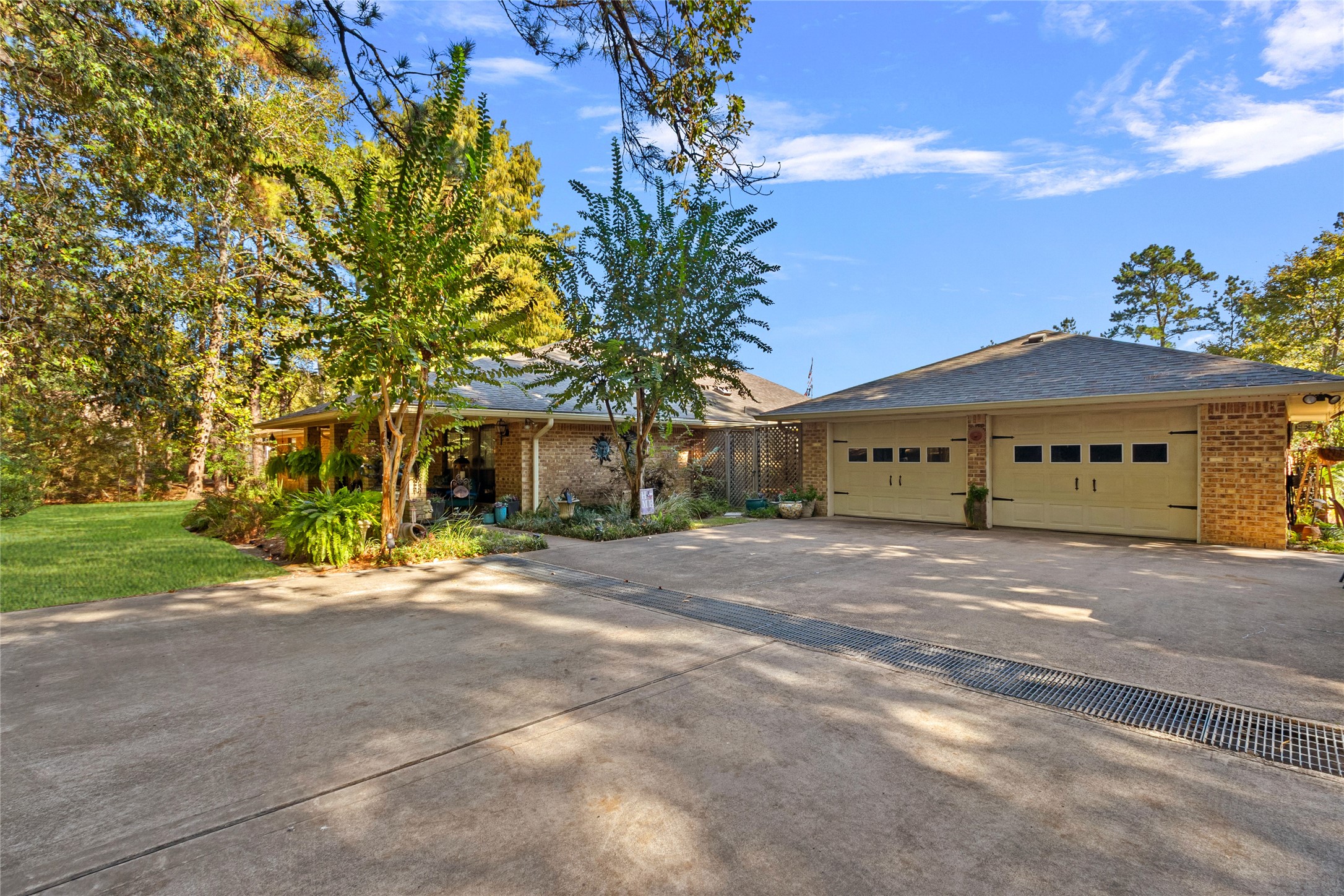 89 Heatley Street Trinity, TX 75862 - Photo 3 of 49 a front view of a house with a yard and garage