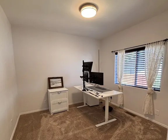 a workspace with furniture and a window