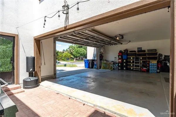 a view of swimming pool with yard from inside the house