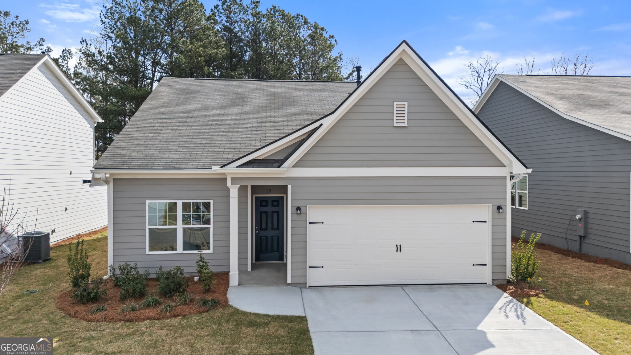 a aerial view of a house with garage