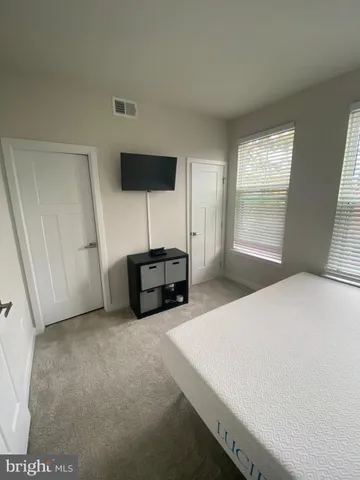 a kitchen that has a microwave and a stove