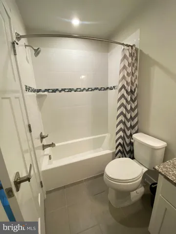 a living room with furniture and window