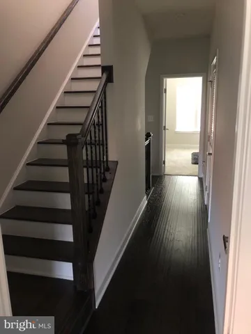 a living room with furniture and a bathroom