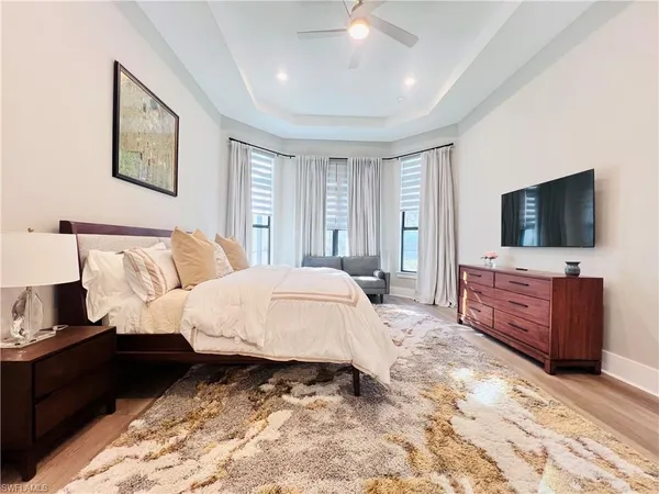 a bed room with a bed and a television