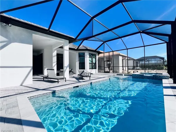 a view of a backyard with sitting area