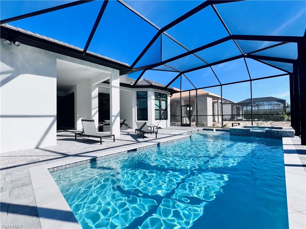 9124 Raintree Street Naples, FL 34114 - Photo 26 of 42 a view of a backyard with sitting area