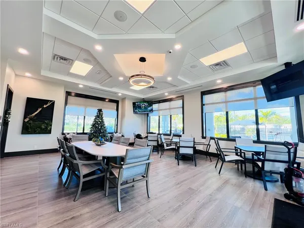 a view of a dining room with furniture window and wooden floor