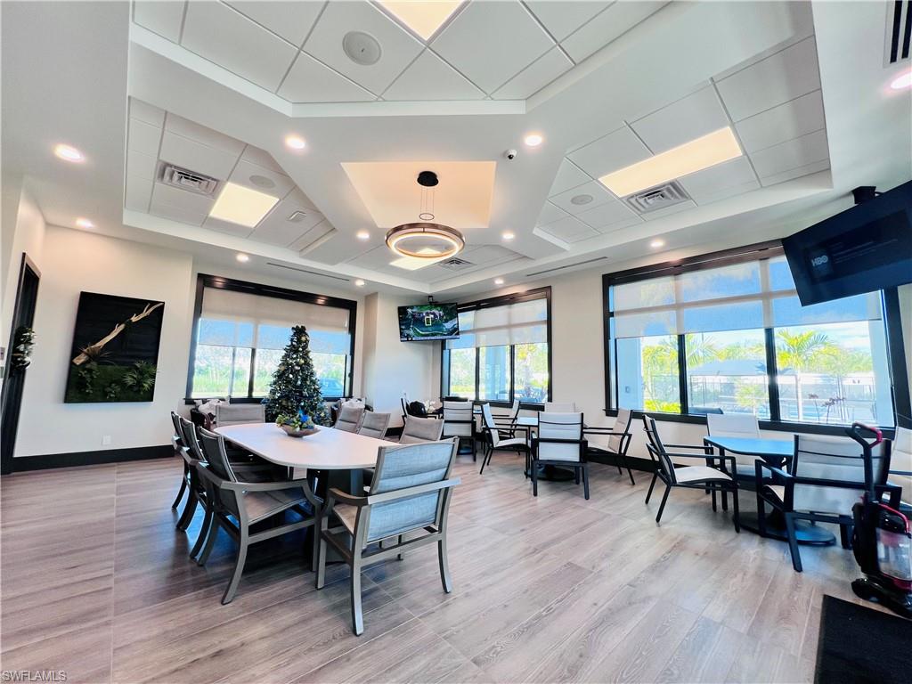 9124 Raintree Street Naples, FL 34114 - Photo 33 of 42 a view of a dining room with furniture window and wooden floor