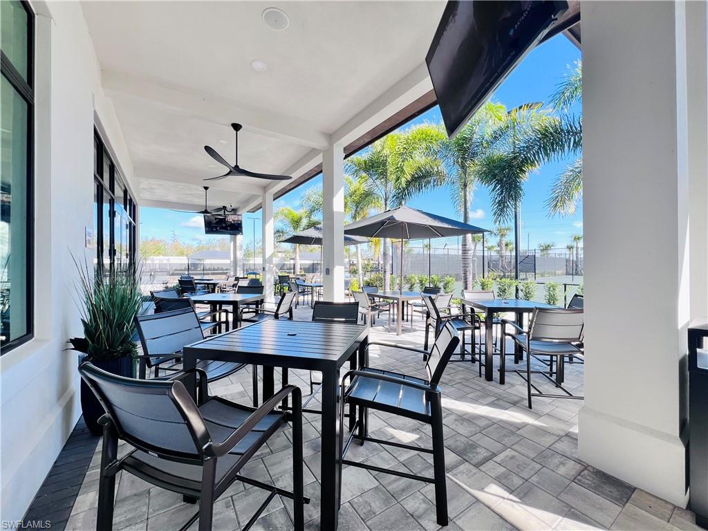 9124 Raintree Street Naples, FL 34114 - Photo 37 of 42 a view of a dining room with furniture window and outside view