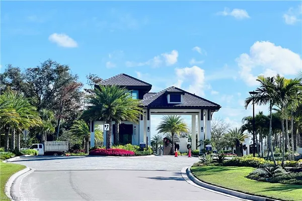 a front view of a house with fountain and entertaining space