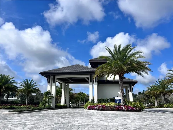 a front view of house with a garden