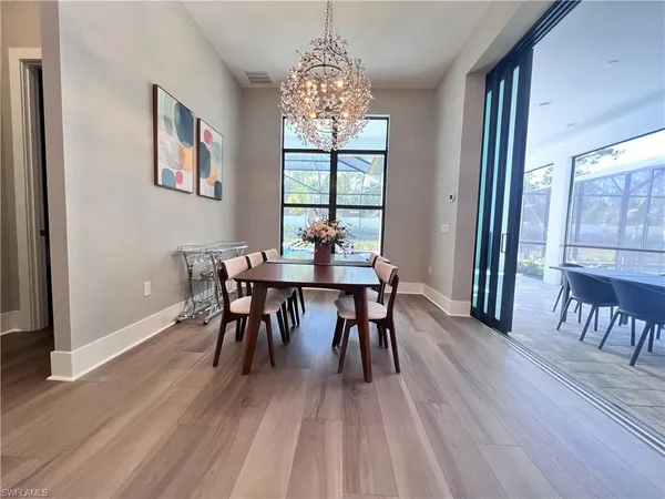 a dining room with furniture window wooden floor