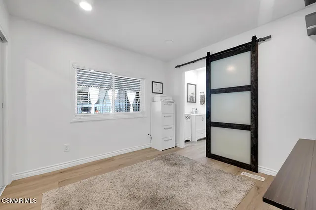 a bathroom with a sink a mirror and a shower