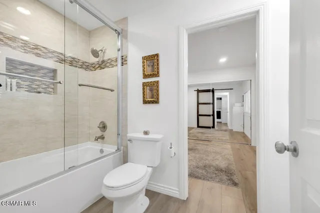 a view of a backyard with sitting area