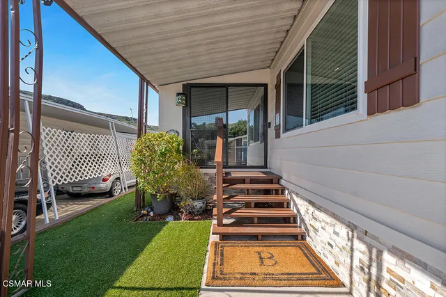 a view of a backyard with sitting area