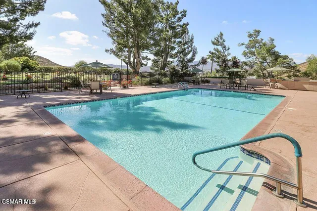 a bedroom with furniture and a fireplace