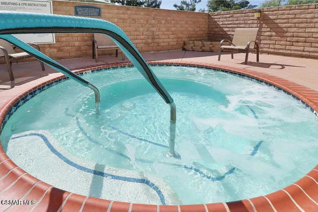 a dining room with furniture and view of a living room