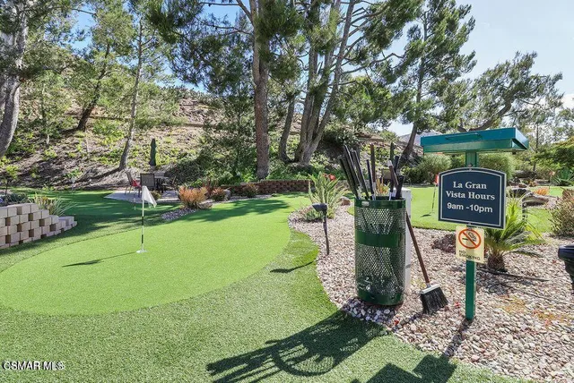 a large kitchen with stainless steel appliances lots of counter top space