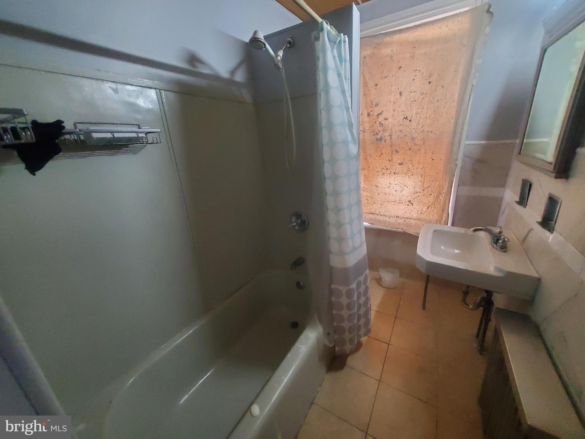 608 North 10th Street, Unit 2 Reading, PA 19604 - Photo 12 of 15 a bathroom with a sink and a mirror